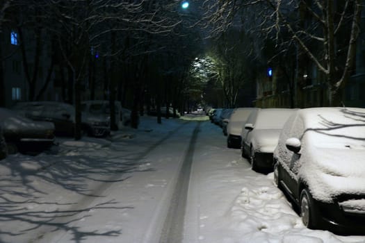 Parked cars covered with snow - snow storm