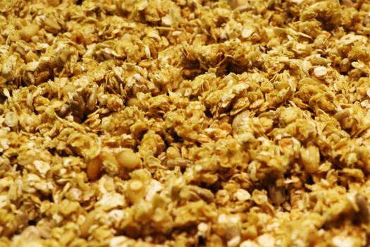 Organic homemade Granola Cereal with oats and almond. Texture oatmeal granola or muesli as background. Top view or flat-lay. Copy space for text