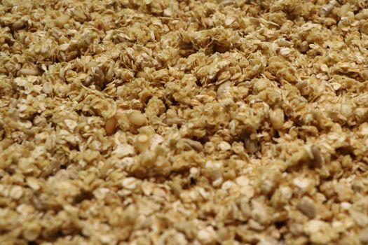 Organic homemade Granola Cereal with oats and almond. Texture oatmeal granola or muesli as background. Top view or flat-lay. Copy space for text