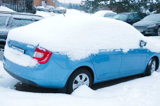 Winter frozen back car window, texture freezing ice glass background