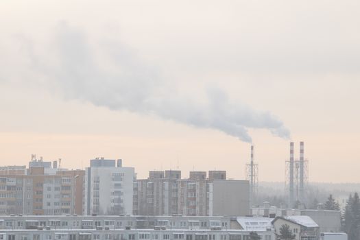 Smoking a pipe of heating plants supplying heat to the city.