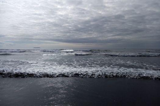 Closeup of foam on a beach ocean, seascape