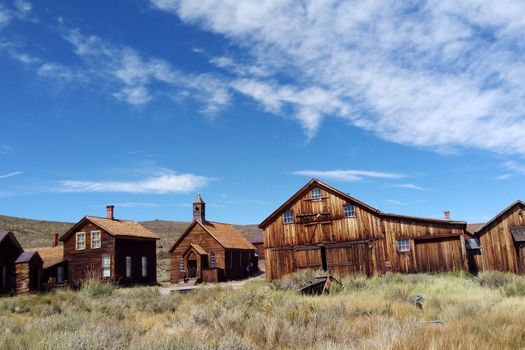 Empty streets of the abandoned ghost town of Bodie in California, USA in the middle of the day