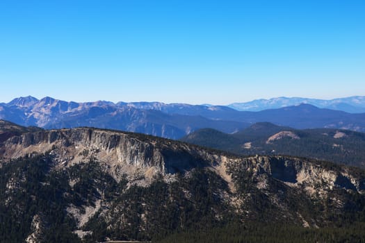 Beautiful mountains against the blue sky. Top view of top of mountain.