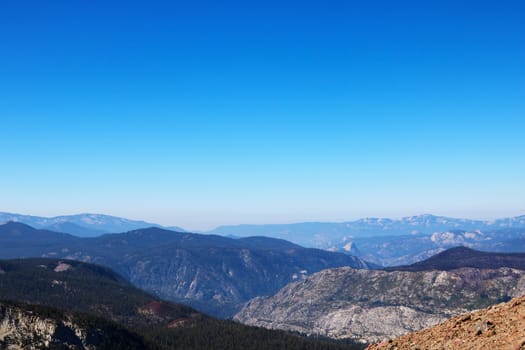 View of the mountain tops against the blue sky.