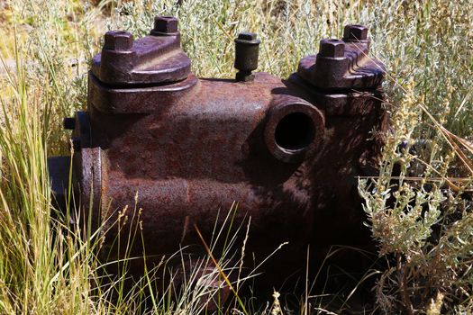 Closeup of an old rusty pump in an abandoned city.