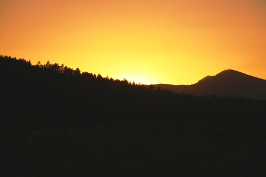 Beautiful sunset in the mountains with a beautiful orange sky