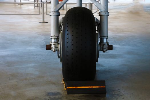 The front landing gear of a small aircraft on the ground