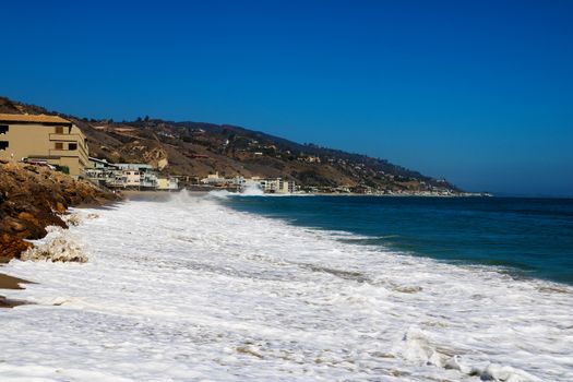 Soft Wave Of Blue Ocean On Sandy Beach. Background. USA