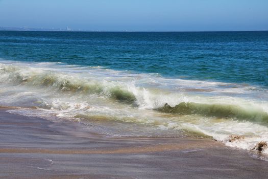 View of White Wave Receding on Perfect Sandy Beach