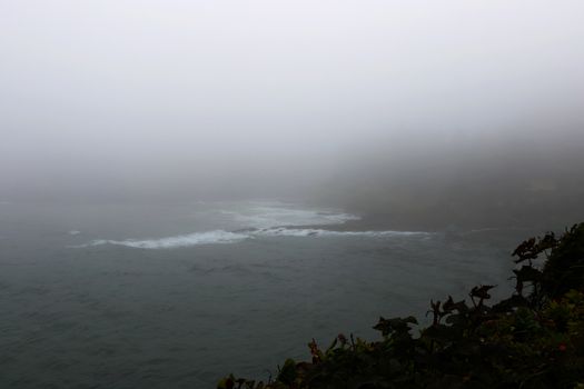 View of the Pacific Ocean in a foggy morning, America.