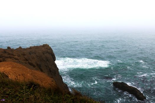 View of the Pacific Ocean in a foggy morning, America.