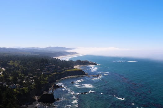 California coast with fog coming from the Pacific to the land.