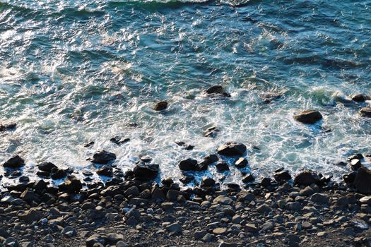 Ocean landscape background, water with waves and rock, ocean view from above, coastline.