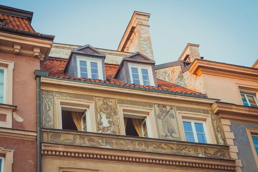 Ancient art on top of a house exterior wall at the Warsaw Old Town.