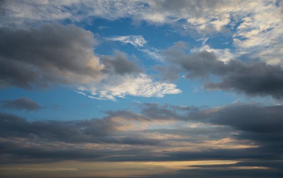 Beautiful dramatic sunset sky with dark clouds