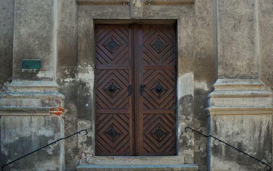 Brown wooden door at entrance of a church