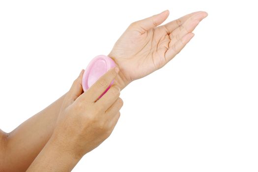 Hygiene and health care topic of woman's hands holding soap isolated on white background, clipping path.