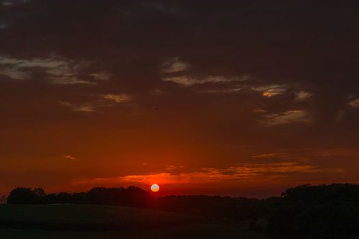 Evening glow, beautiful reddish color of the evening sky at the low sun.