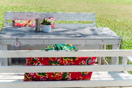 Image of Empty table in the house's garden.