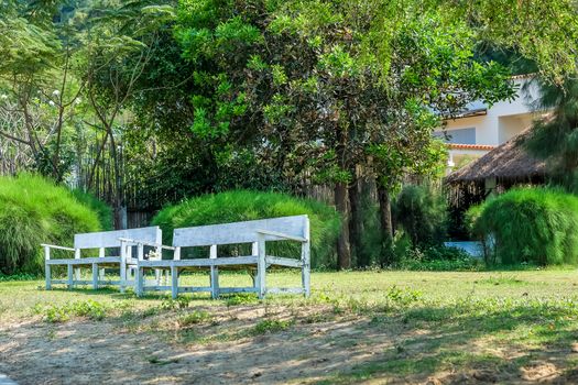 White retro style wooden bench in garden