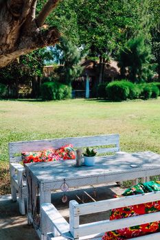 Image of Empty table in the house's garden.