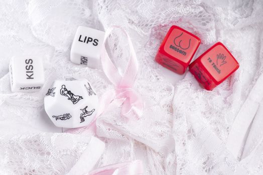 Cube with sexy poses, Kama Sutra. Toys for adults. Sex toys. Cubes with Kama Sutra poses for sex games. Playing cubes of red and white color for sexual games.