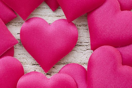Valentines day romantic background, happy holiday on February 14, love concept. Postcard on a wooden background, decorated with hearts. Decorative card for the holiday. Vanentine Day.