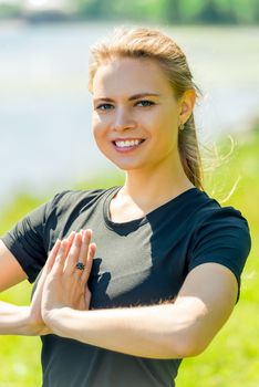 portrait of an experienced yoga trainer welcomes to classes