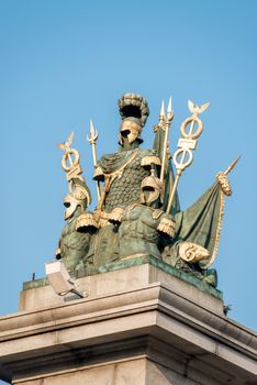 Sculpture of military athletes adorns the bridge in the city