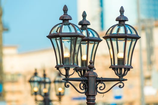 Closeup of vintage metal lantern in the city