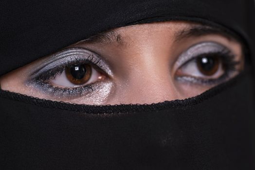 Arab girl close-up. Eyes of the Arab girl.Young arabian woman in hijab.