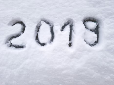 digits 2019 on the snow,happy new year 2019 concept.
