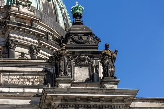 A close-up exterior view on a sculptural composition on the roof of Dom Berliner, also known as the Berlin Cathedral in the historic city of Berlin in Germany.