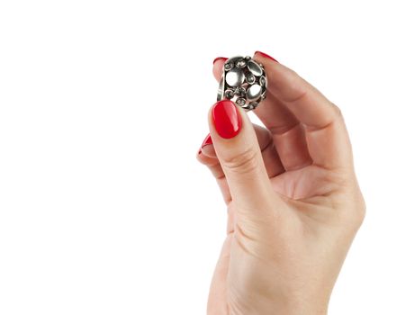 Female hands with red manicure wear a silver ring, isolated on white background