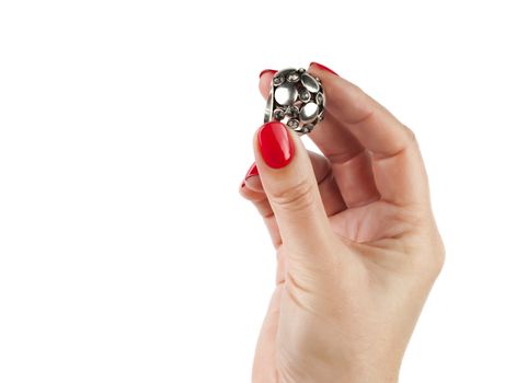 Female hands with red manicure wear a silver ring, isolated on white background