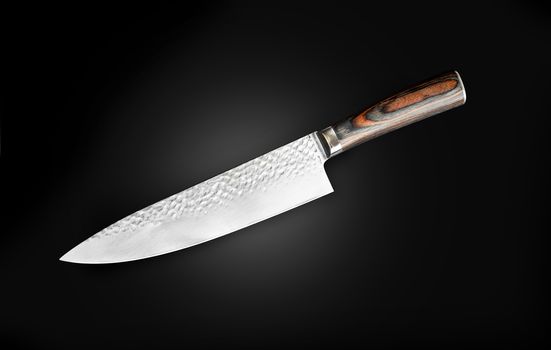 Chef's knife for your kitchen isolated on black background. With clipping path