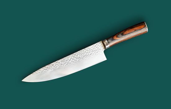 Chef's knife for your kitchen isolated on green background. With clipping path