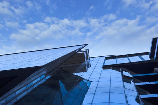 Beautiful skyscraper with architecture and glass window exterior of building around business area in the city. Closeup