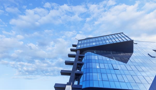 Beautiful skyscraper with architecture and glass window exterior of building around business area in the city. Closeup