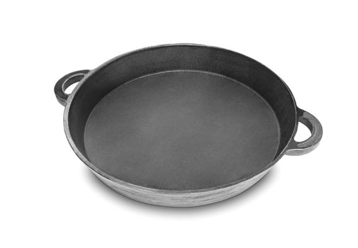 Cast iron pan for paella. Isolated on white background