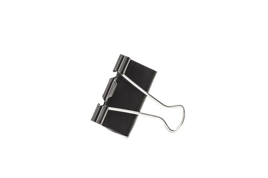 Paper clip isolated from white background. A paperclip is a device for office use to clamp a device such as paper and more.