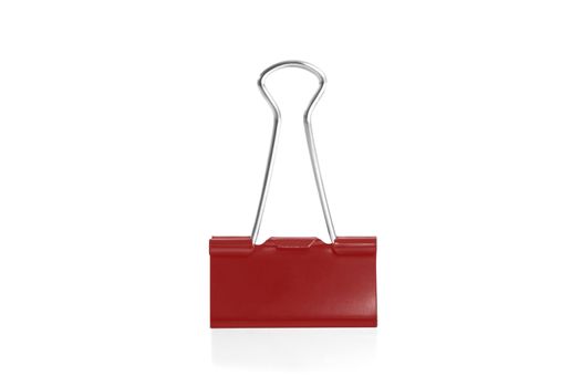 Paper clip isolated from white background. A paperclip is a device for office use to clamp a device such as paper and more.