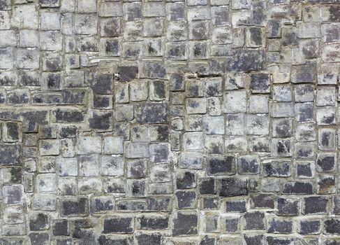 Antique natural stonewall, old stones in different sizes