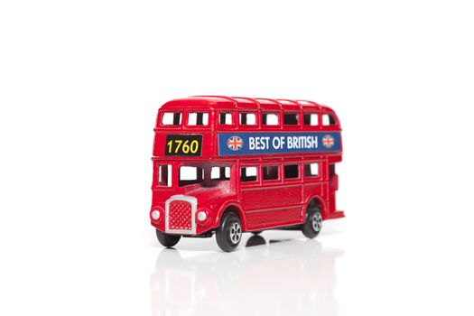 CHISINAU, MOLDOVA - May 01, 2018: Red Double-decker bus miniature toy. London traditional souvenirs and popular city symbols. Isolated on white background