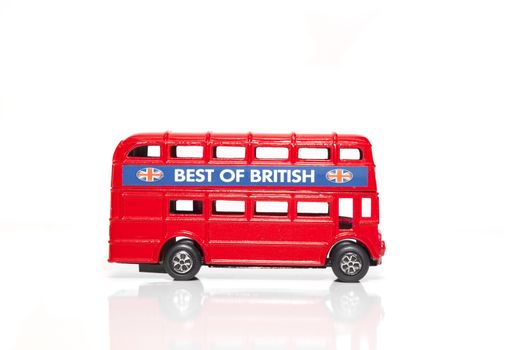 CHISINAU, MOLDOVA - May 01, 2018: Red Double-decker bus miniature toy. London traditional souvenirs and popular city symbols. Isolated on white background