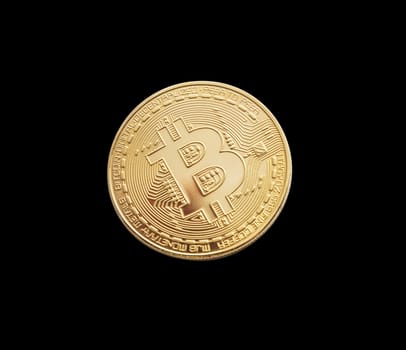 Bitcoin. Golden bitcoin isolated on black background. With clipping path.