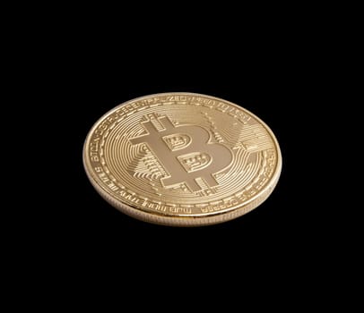 Bitcoin. Golden bitcoin isolated on black background. With clipping path.