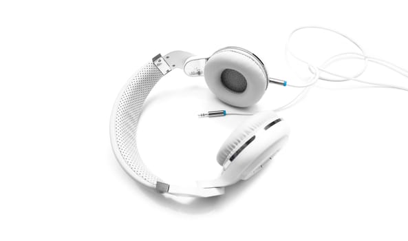 White headphones and Convention Aux cable 3.5 mm. Isolated on white background