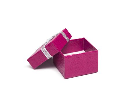 Open rose color gift box with silver ribbon isolated on white background